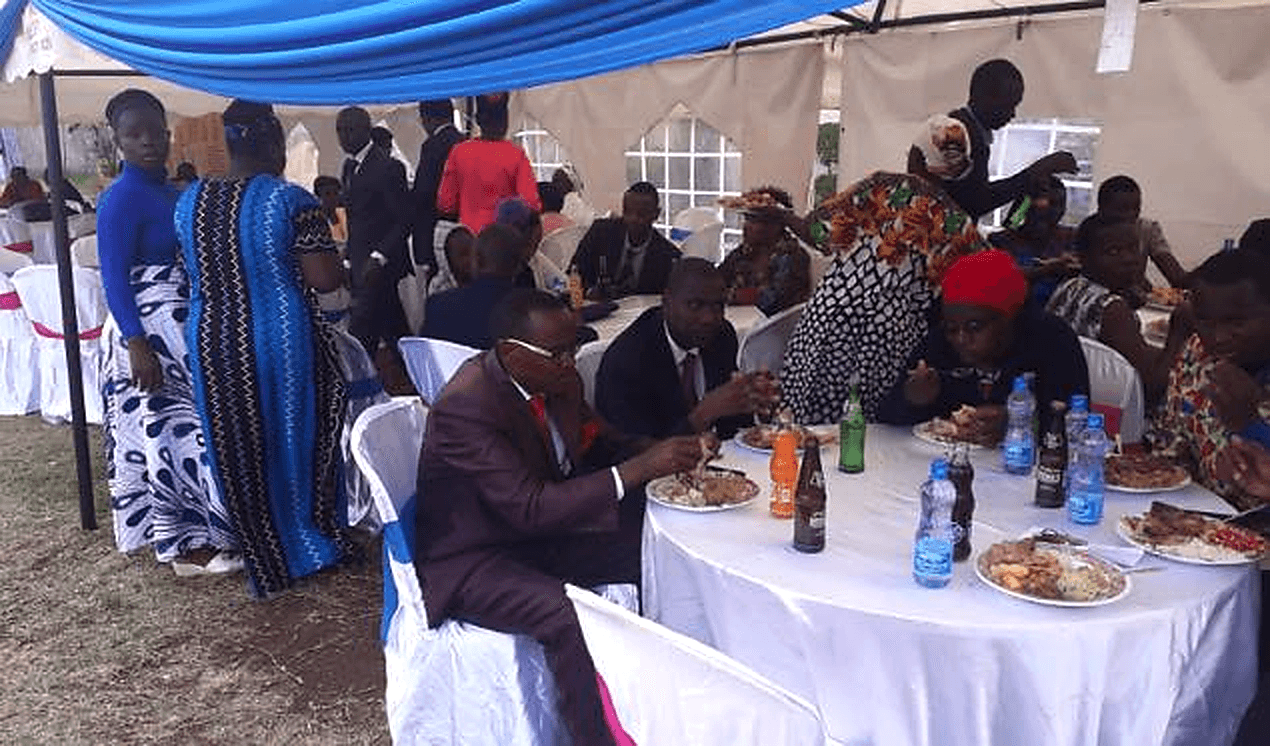 An evening fundraising dinner event with guests seated at tables